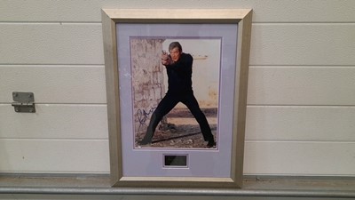 Lot 599 - FRAMED SIGNED PHOTO OF ROGER MOORE AS JAMES BOND 21"X17"