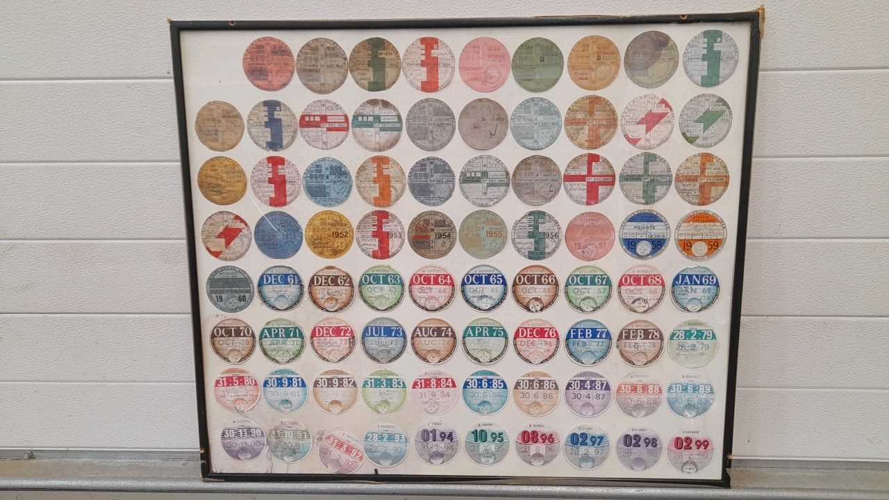 Lot 51 - FRAMED ORIGINAL  TAX DISCS FROM  1921-1999