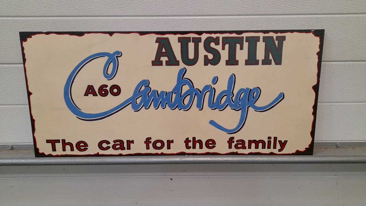 Lot 149 - WOODEN HAND PAINTED AUSTIN CAMBRIDGE SIGN  32" X 14"