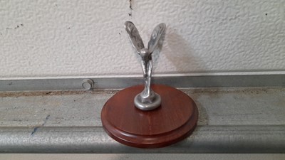 Lot 881 - 1/2 SCALE SPIRIT OF ECSTASY ON POLISHED HARDWOOD BASE  3" TALL - ALL PROCEEDS TO CHARITY