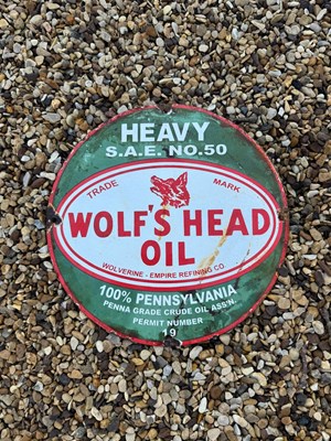 Lot 457 - WOLF'S HEAD OIL ENAMEL SIGN 12" DIA