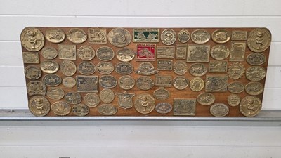 Lot 737 - BRASS PLAQUES MOUNTED ON A WOODEN BOARD 48" X 18"