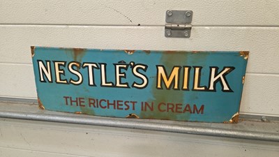 Lot 617 - NESTLE'S MILK ENAMEL SIGN 24" X 8"