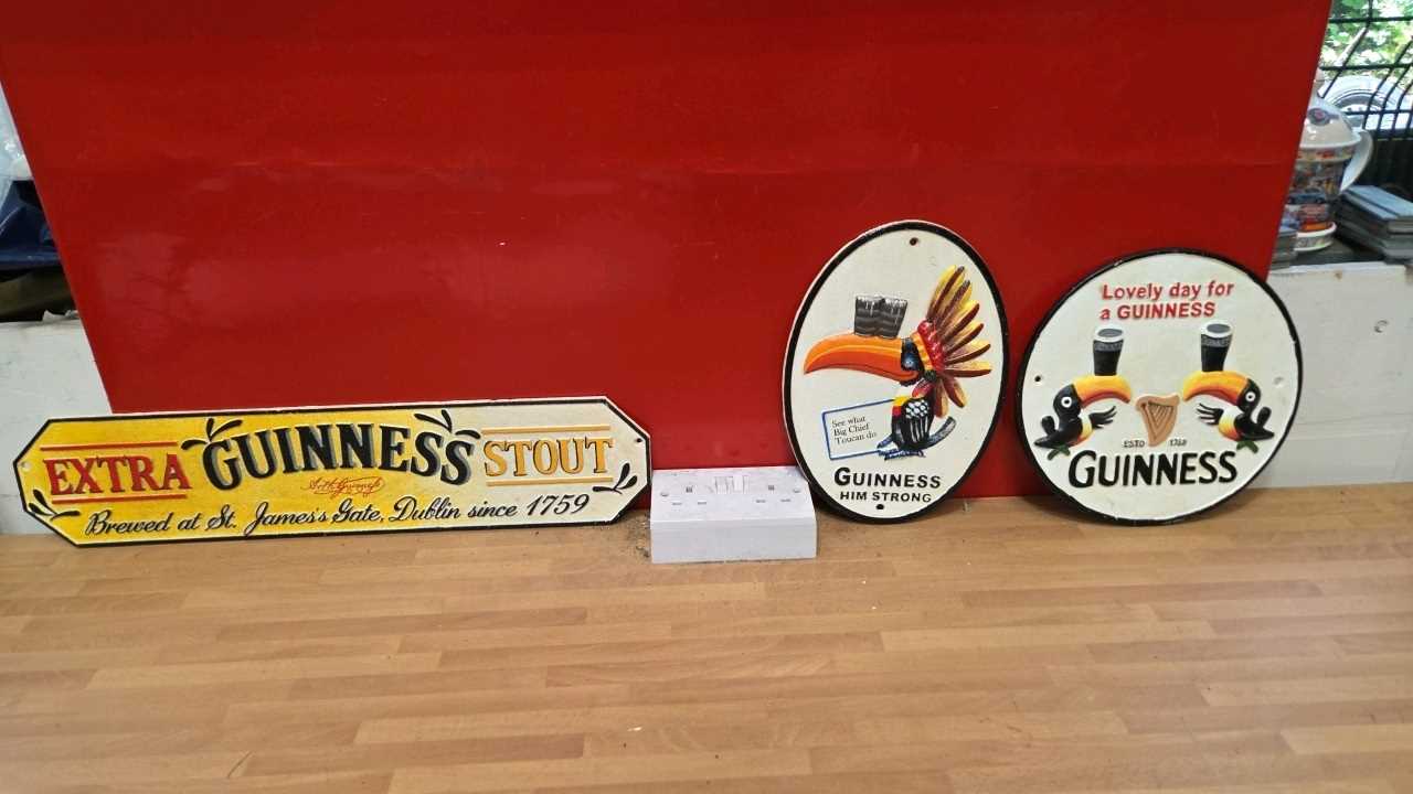 Lot 163 - SET OF 3 CAST IRON GUINNESS SIGNS