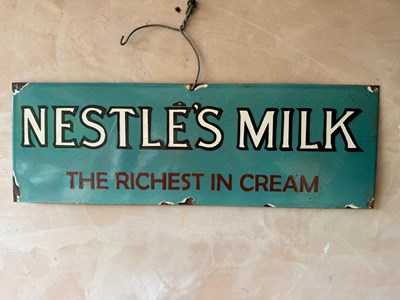 Lot 863 - NESTLE'S MILK ENAMEL SIGN 24" X 8"