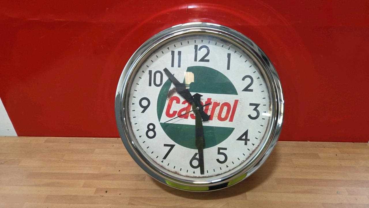 Lot 377 - CASTROL STYLE WALL CLOCK 12" DIA