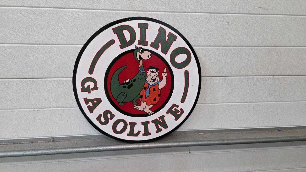 Lot 437 - WOODEN HAND PAINTED DINO GASOLINE SIGN 19" DIA