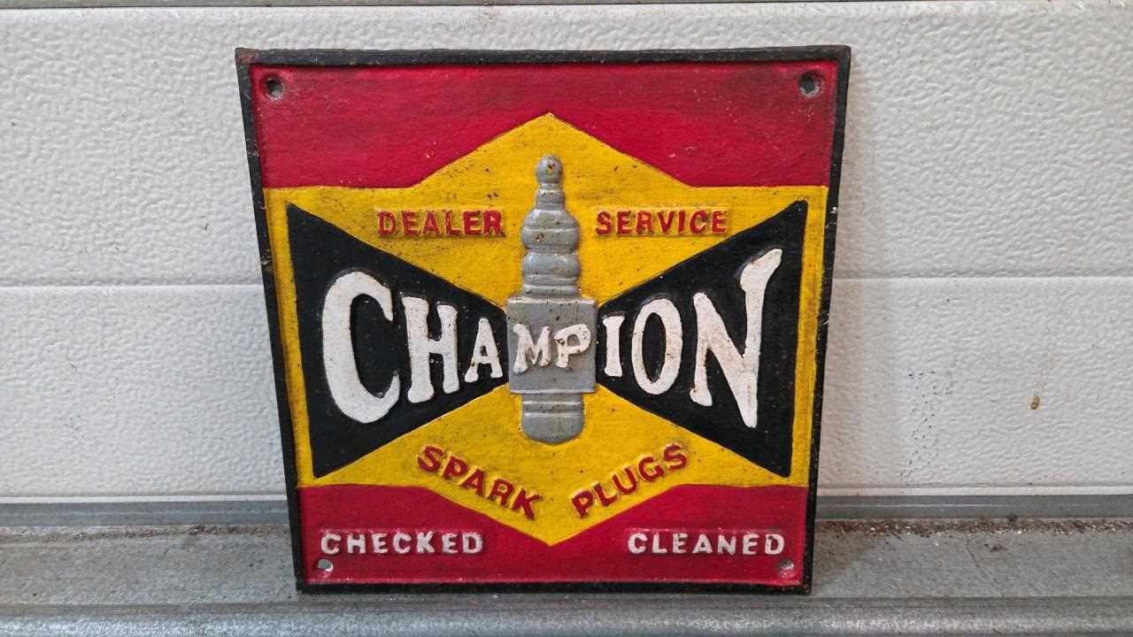 Lot 863 - CHAMPION SPARK PLUGS CAST SIGN 10" X 10"
