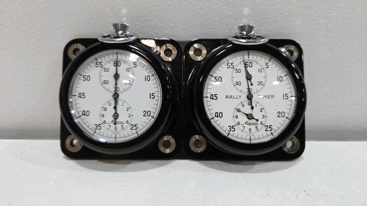 Lot 47 - TWIN MINERVA RALLY TIMER ON A METAL MOUNTING PLATE 5" X 2.5"