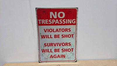 Lot 879 - TIN PRINTED REPRO NO TRESPASSING SIGN 27" X 20"