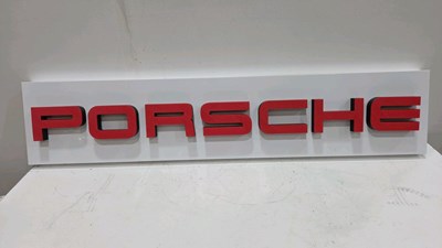 Lot 181 - PORSCHE PLASTIC REPRODUCTION SIGN 56" X 12"