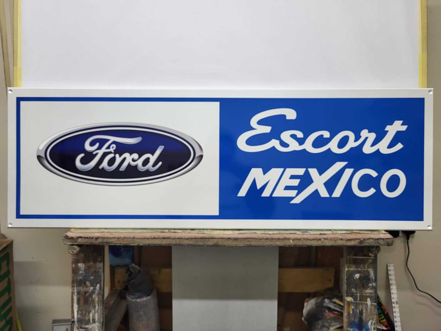 Lot 747 - MDF HAND PAINTED FORD ESCORT MEXICO SIGN 48" X 16"