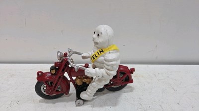 Lot 295 - CAST MICHELIN MAN ON RED BIKE 9" X 6"