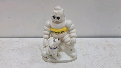 Lot 631 - CAST MICHELIN MAN AND DOG 6" X 8"