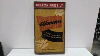 Lot 579 - TIN WOMANS WEEKLY SIGN ON WOODEN BOARD APPROX 30" X 19"