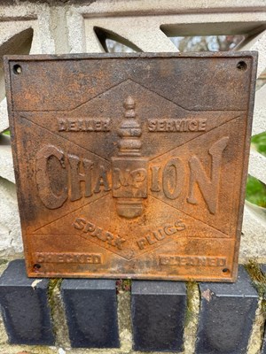 Lot 445 - CAST IRON CHAMPION SIGN 10" x 10"
