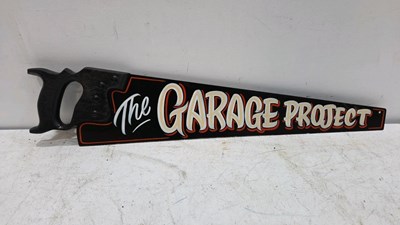 Lot 449 - WOOD SAW WITH "THE GARAGE PROJECT " PAINTED ON IT