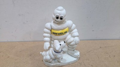 Lot 263 - CAST MICHELIN MAN WITH DOG , APPROX 9"