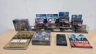 Lot 869 - MIXED LOT OF JAMES BOND SCALE MODEL CARS, SPY CAMERA & 2 BOOKS
