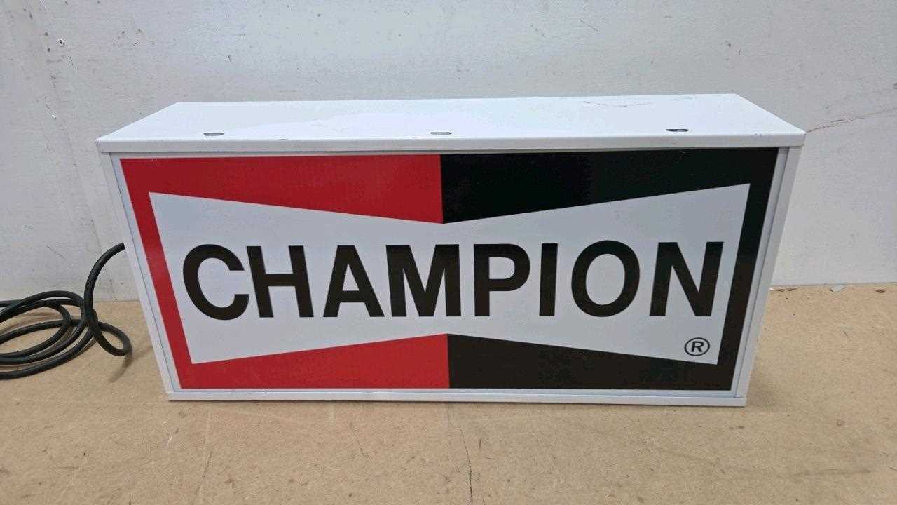 Lot 65 - CHAMPION LIGHT UP SIGN 23" X 11"