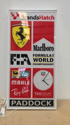 Lot 625 - ILLUMINATED BRANDS HATCH FORMULA 1 FERRARI PADDOCK CLOCK 48" X 24"