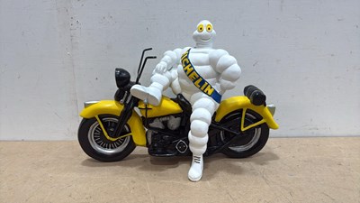 Lot 675 - MICHELIN MAN ON MOTORBIKE 18" X 13"