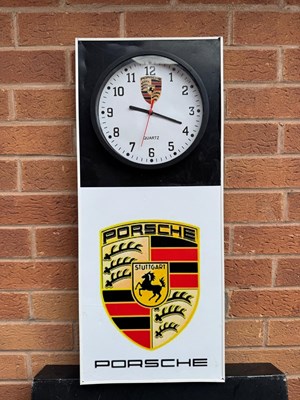Lot 393 - PORSCHE STYLE WALL CLOCK 27" X 12"