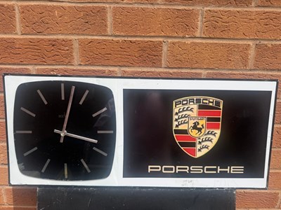 Lot 491 - PORSCHE STYLE WALL CLOCK 27" X 12"