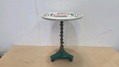 Lot 273 - SIDE TABLE MADE FROM A CAMSHAFT, WITH A HAND PAINTED CASTROL TOP